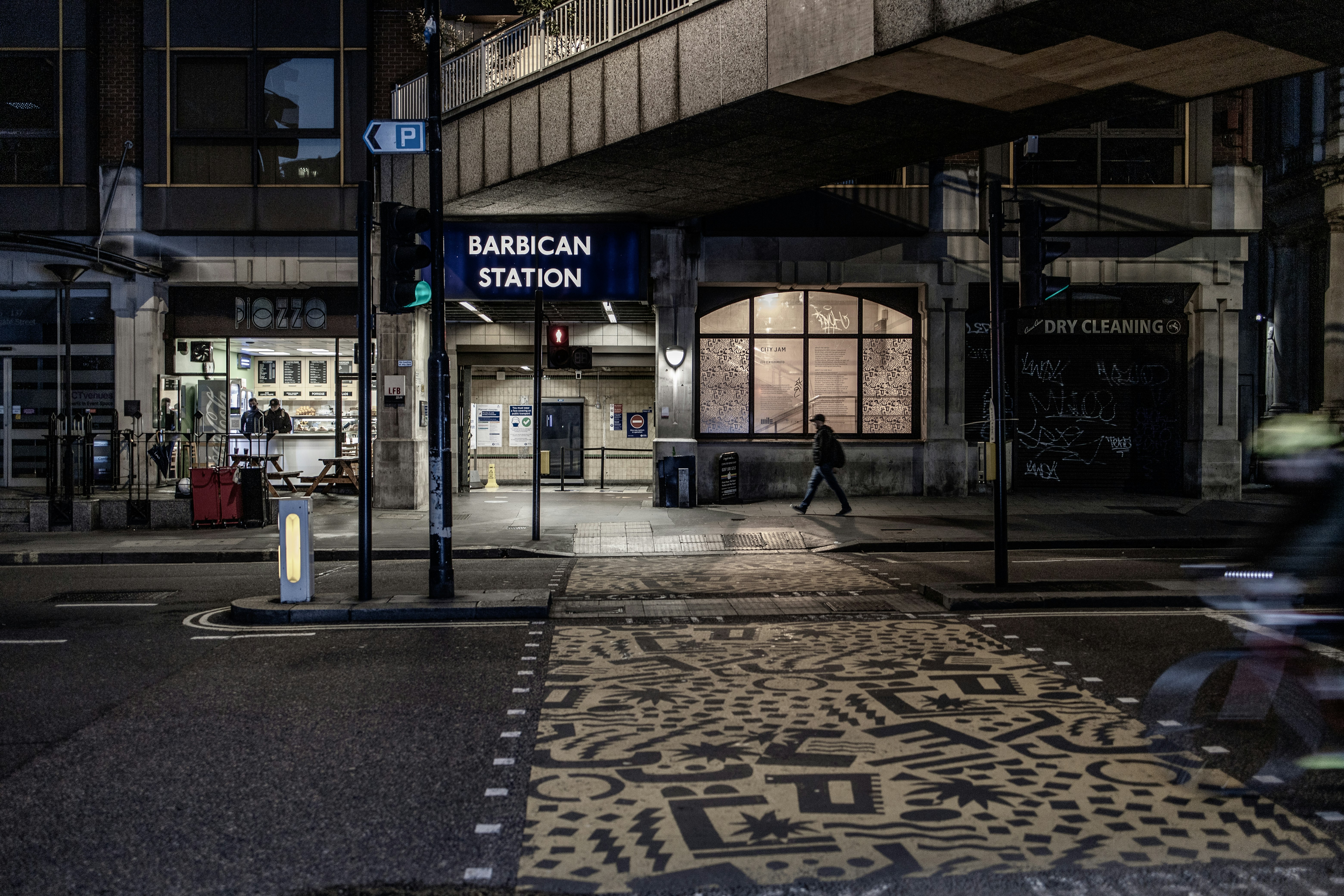 black metal stand near brown and white building